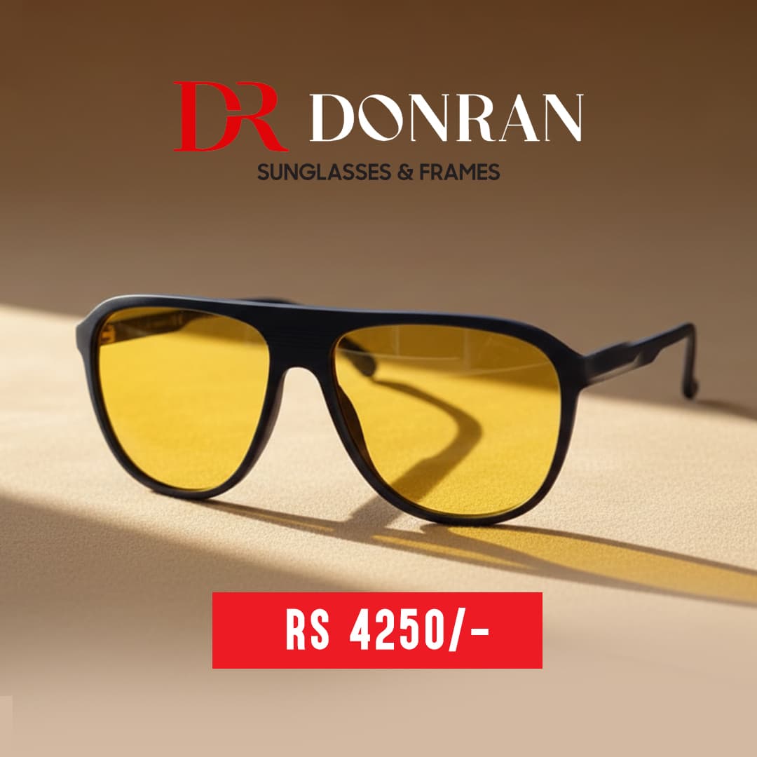 Donran black frame sunglasses with yellow lenses on a sandy background, priced RS 4250.